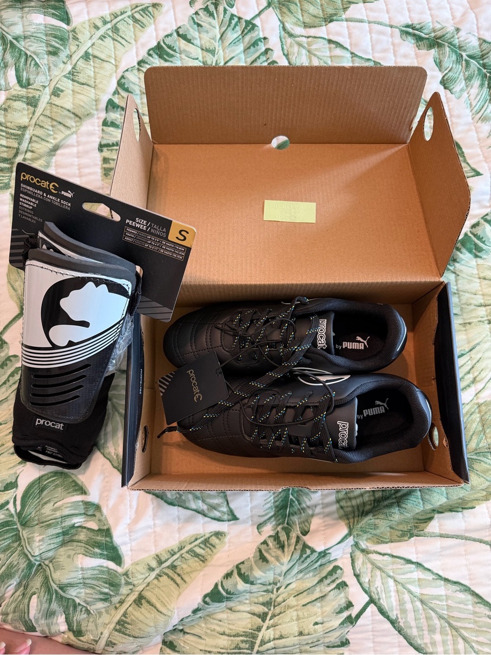 Puma Kid’s Black Low-Profile Cleats with Reflective Accents and PeeWee Shinguard